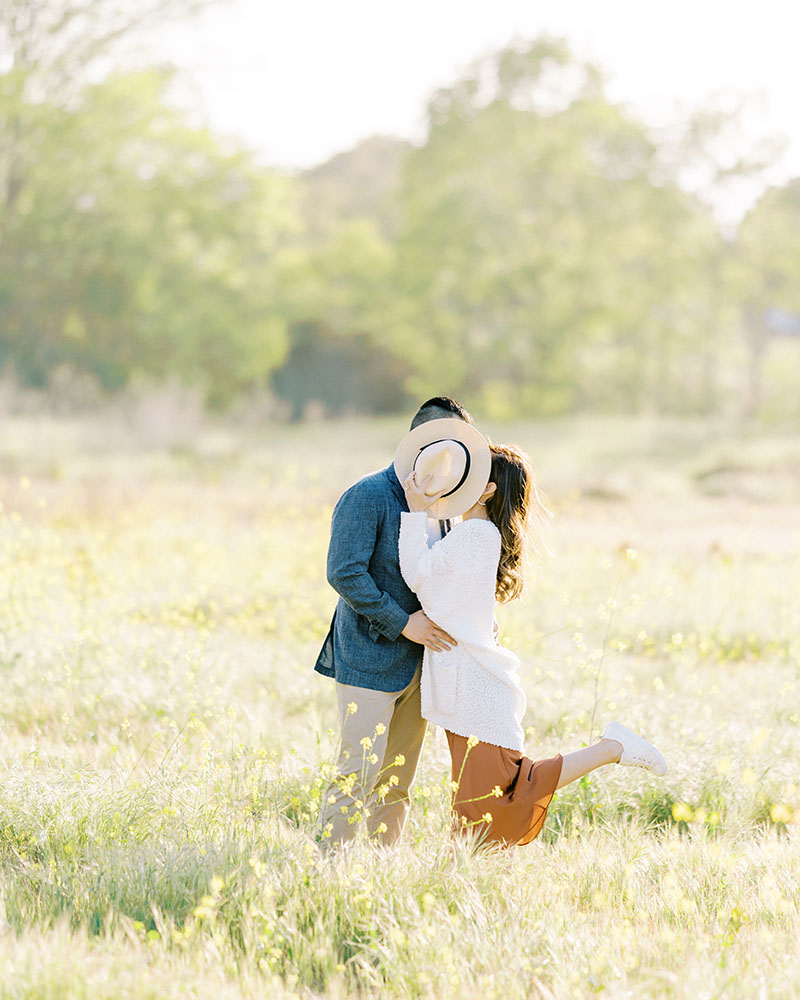 open fields yellow flowers engagement session